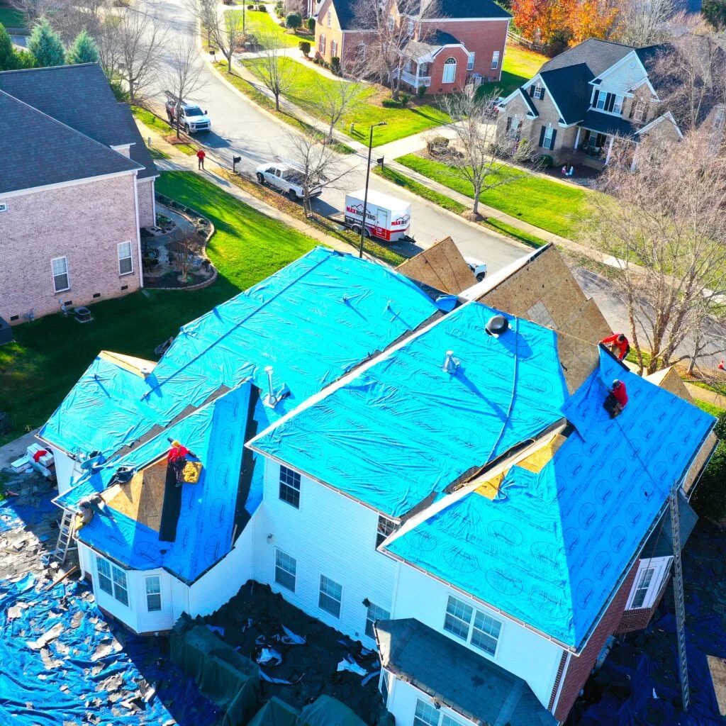 Professional roofing installation on residential home